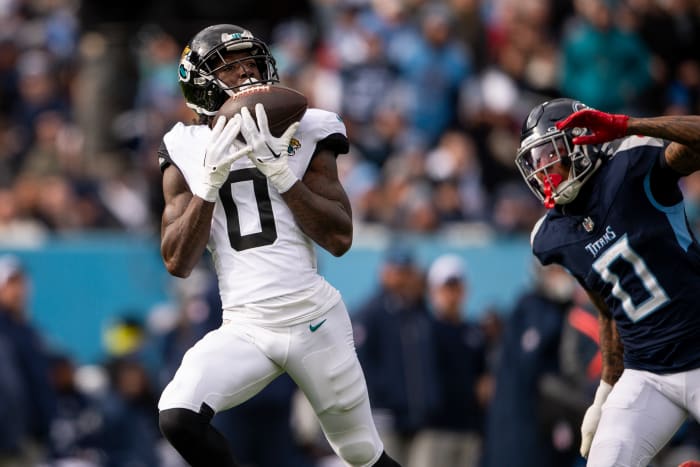 Jan 7, 2024; Nashville, Tennessee, USA; Jacksonville Jaguars wide receiver Calvin Ridley (0) scores a touchdown against the Tennessee Titans during the first half at Nissan Stadium.